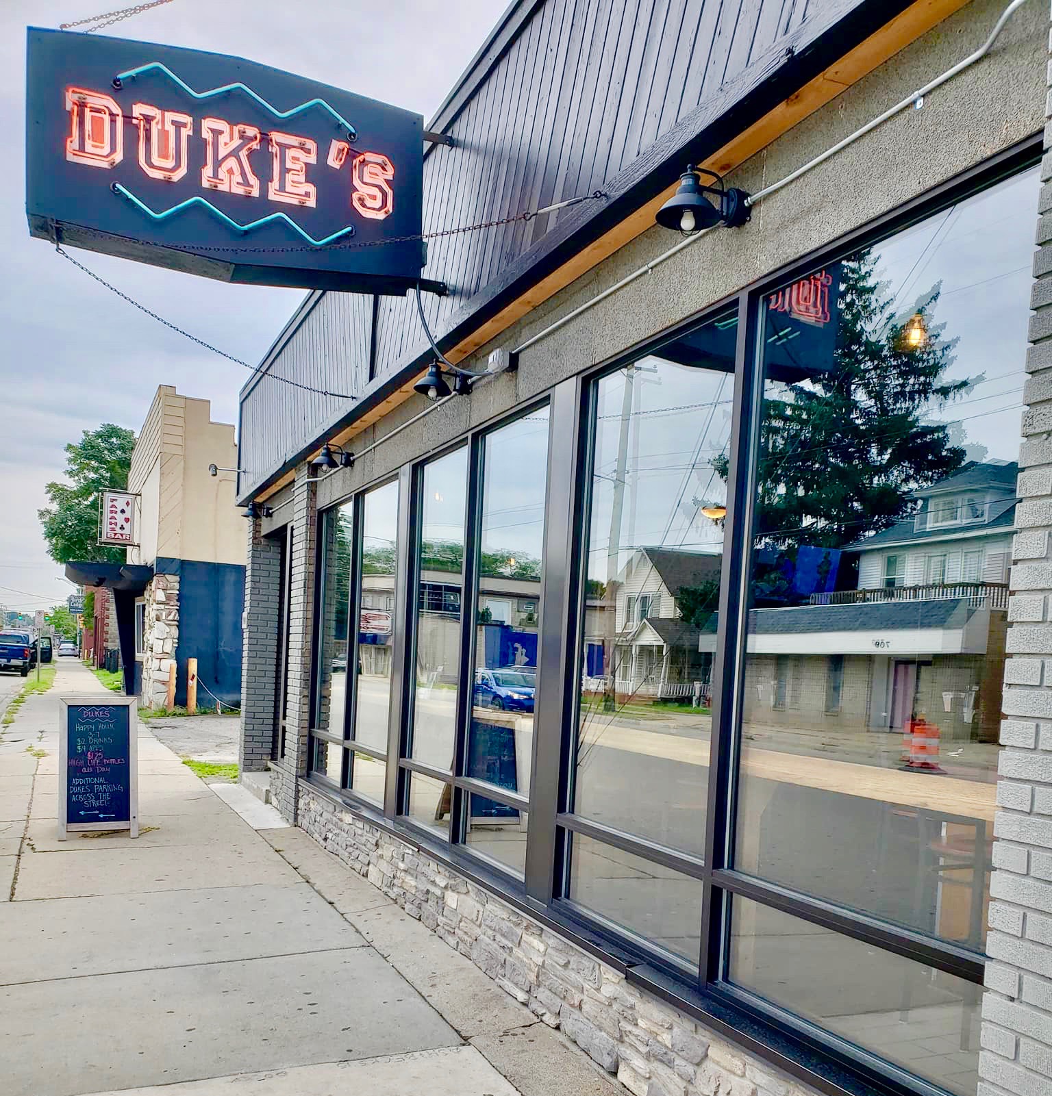 Duke's Social House exterior, neon sign and storefront on Michigan St NE