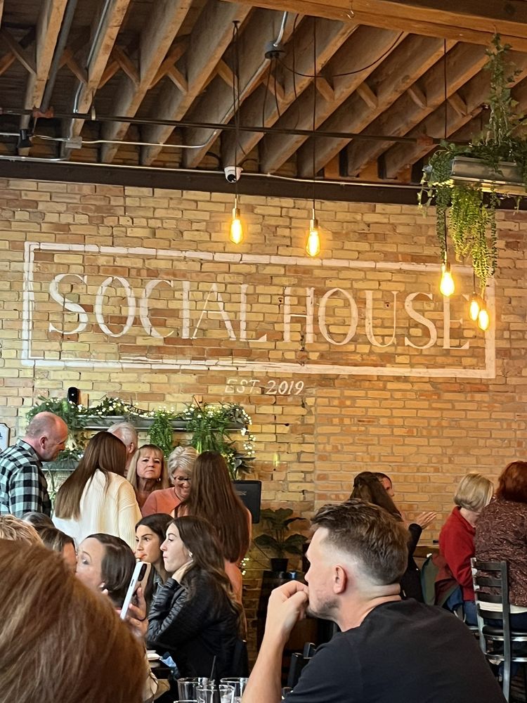 Packed house at Grand Rapids, Social House neon on brick